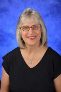 A head-and-shoulders professional photo of Julie Gill