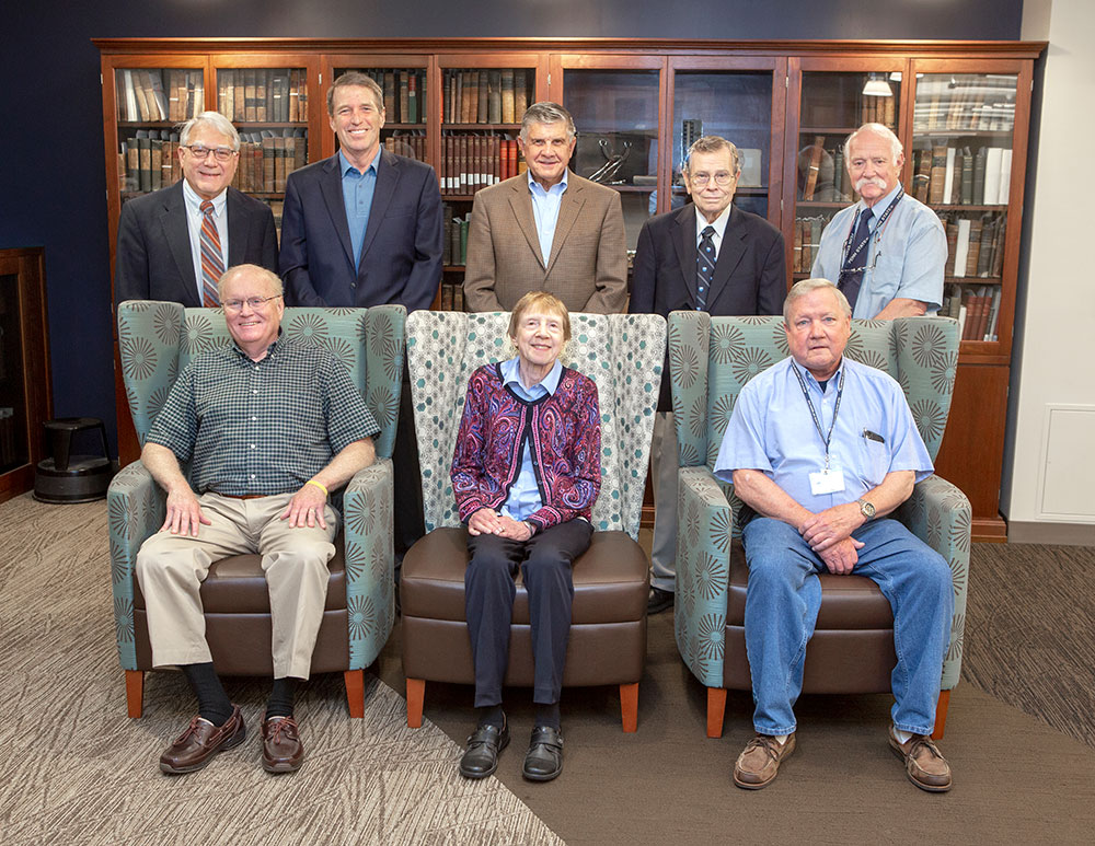 Penn State College of Medicine's Emeritus Faculty Organization officers are seen in June 2019. Three are sitting and five are standing behind them.